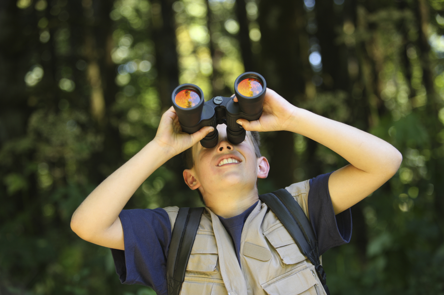 Boy with Binoculars in outdoor setting